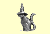 A cat with a witch's hat, solid metal figure,